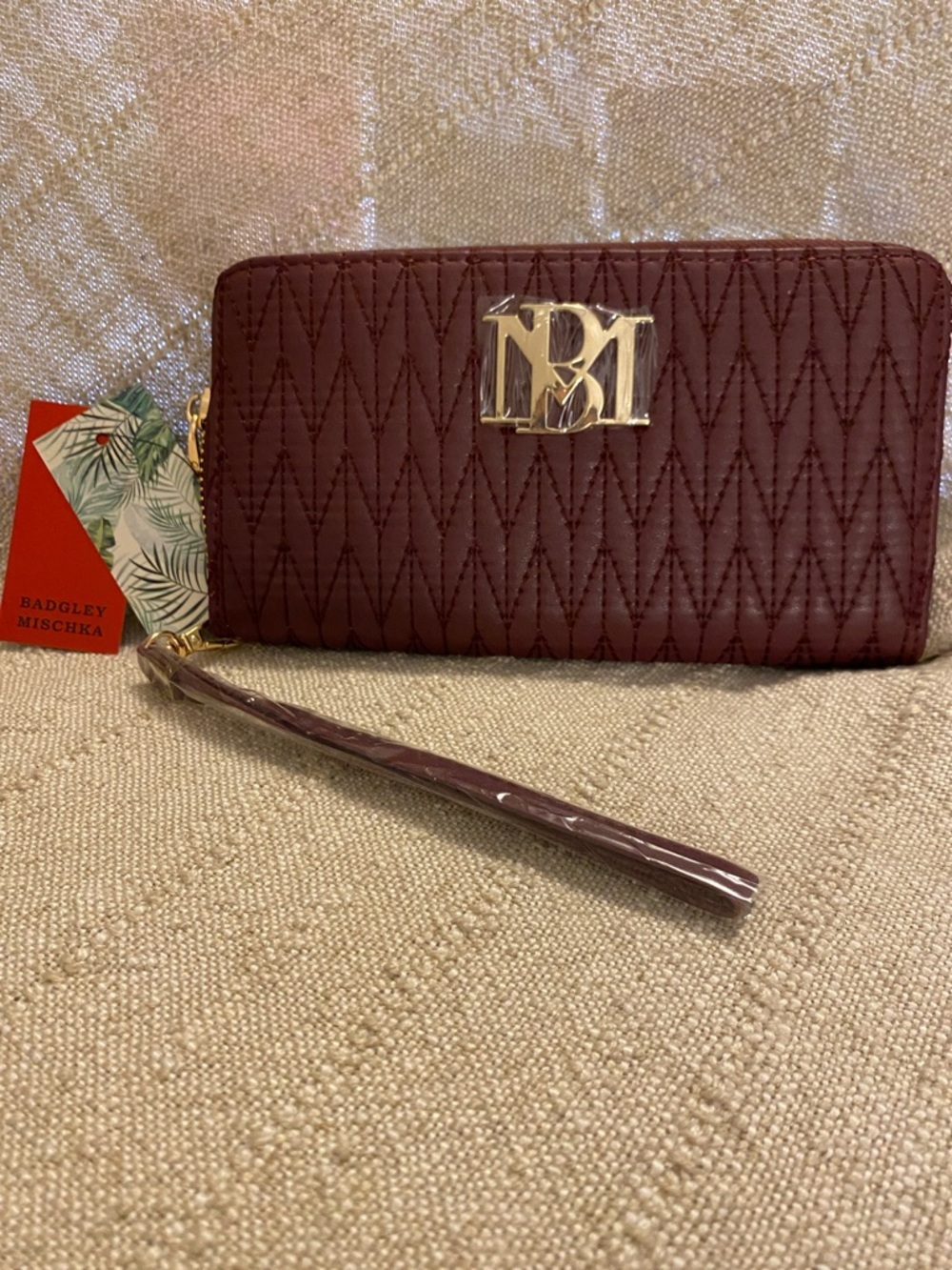 Badgley Mischka Quilted Wristlet in Burgundy with Gold Logo